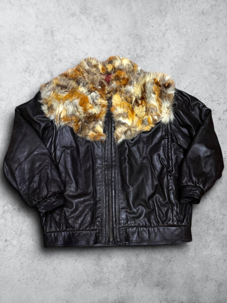 Chaqueta de cuero genuino con pelo natural, estilo vintage y elegante. Perfecta para un look clásico.