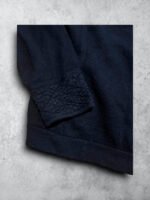 Jersey negro Burberry con cremallera y detalles de cuero vintage.