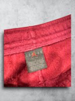 Pantalón de chándal Jordan en color burdeos, vintage y de cuero, ideal para estilo deportivo y casua.